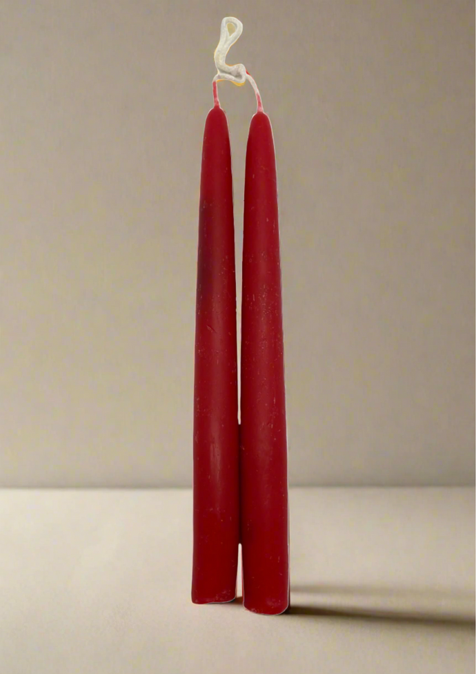 Pair of beeswax dipped red candles