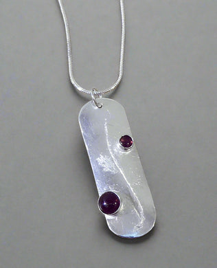 Jane Vernon Fine silver 42mm long pendant, engraved and set with two garnets, on an 18” sterling silver