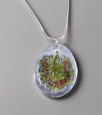 Jane Vernon Fine silver oval pendant with geranium leaf impression and colour