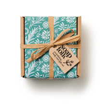 Load image into Gallery viewer, Gift box with floral pattern and brown ribbon on a white background