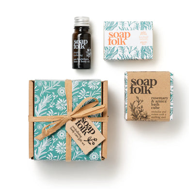 Collection of Soap Folk products including a bottle, bar, and box on a white background