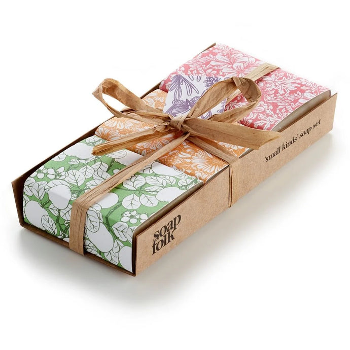 Box of soap bars with floral designs and 'soap folk' branding on a white background
