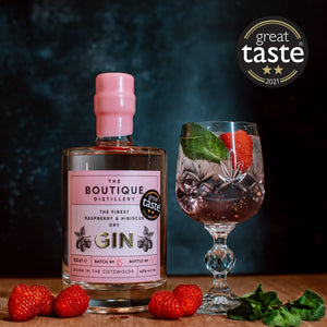 Boutique distillery pink Cotswold gin with raspberry’s and hibiscus flowers  50cl