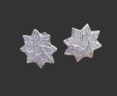 Fine silver tiny heart-shaped earrings, 16mm long, on sterling silver earwires.
(Fine silver is 99.9% silver and sterling silver is 92.5% silver.)
