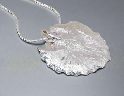 Jane Vernon Fine silver leopards bane leaf pendant 