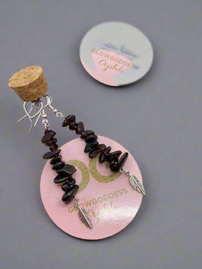 Garnet earrings with feather detail